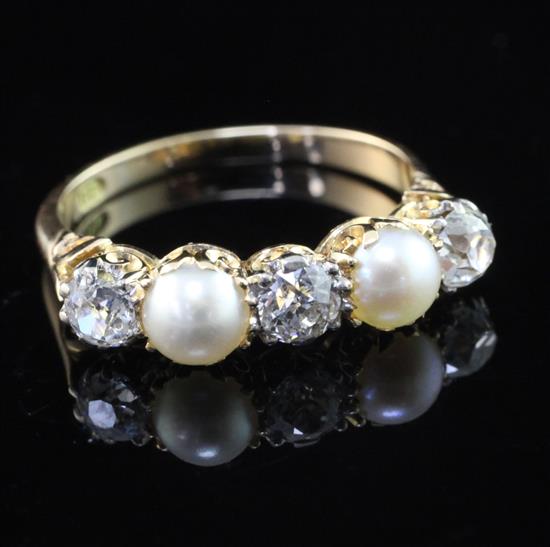 An 18ct gold, split pearl and diamond five stone half hoop ring, size O.